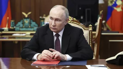 Russian President Vladimir Putin listens to VTB Bank Chairman Andrei Kostin during their meeting at the Kremlin in Moscow, Russia, Monday, June 24, 2024. (Vyacheslav Prokofyev, Sputnik, Kremlin Pool Photo via AP)