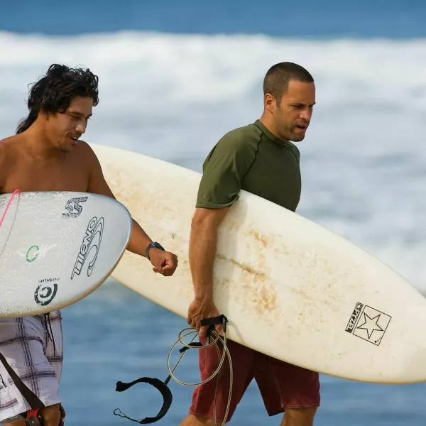 CAGCG7 Feb 06, 2008 - Oahu, Hawaii, USA - File: TAMAYO PERRY and JACK JOHNSON head out for a surf at home on the North Shore. Johnson releases 'Sleep Through The Static' his fifth studio album, released on February 5, 2008. The effort was announced on Johnson's personal website as renovation began for the 