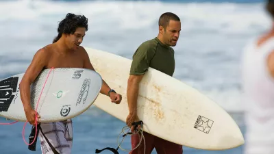 CAGCG7 Feb 06, 2008 - Oahu, Hawaii, USA - File: TAMAYO PERRY and JACK JOHNSON head out for a surf at home on the North Shore. Johnson releases 'Sleep Through The Static' his fifth studio album, released on February 5, 2008. The effort was announced on Johnson's personal website as renovation began for the 