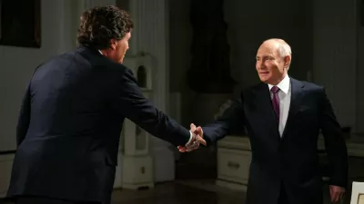 09 February 2024, Russia, Moscow: Russian President Vladimir Putin shakes hands with US journalist Tucker Carlson during an interview. Photo: -/Kremilin Pool/dpa