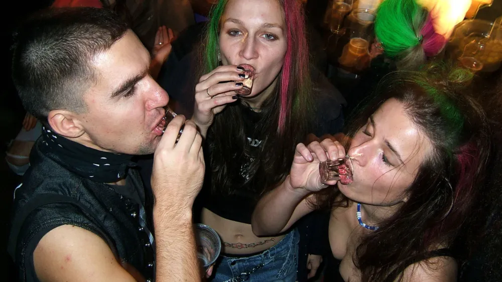 People slam shots of vodka to celebrate during a New Years party in a bar in downtown Prague, Czech Republic, Dec. 31, 2004. Drinking is a national pastime in this beer-loving country, but authorities and health experts concede they've got trouble on their hands: a growing number of underaged youths, some as young as 10, who are hitting the bottle regularly. (AP Photo/Petr David Josek)