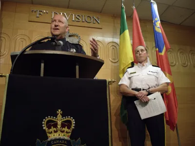 Regina Police Chief Evan Bray, left, speaks while Assistant Commissioner Rhonda Blackmore, right, looks on during a press conference at Royal Canadian Mounted Police "F" Division Headquarters in Regina, Saskatchewan, on Monday, Sept. 5, 2022. Damien Sanderson and Myles Sanderson allegedly stabbed and killed multiple people between James Smith Cree Nation and Weldon, Saskatchewan, on Sunday morning. Today, the RCMP said Damien was located deceased at the First Nation, while his brother Myles is still at large. (Michael Bell/The Canadian Press via AP)