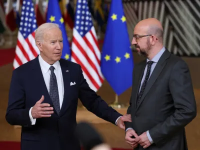 U.S. President Joe Biden speaks to the media next to European Council President Charles Michel, during a European Union leaders summit, amid Russia's invasion of Ukraine, in Brussels, Belgium, March 24, 2022. REUTERS/Evelyn Hockstein