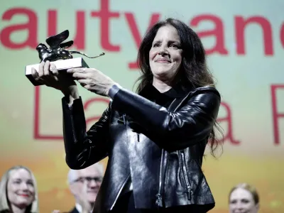 The 79th Venice Film Festival - Awards Ceremony - Venice, Italy, September 10, 2022 - Director Laura Poitras receives the Golden Lion Award for Best Film. REUTERS/Guglielmo Mangiapane