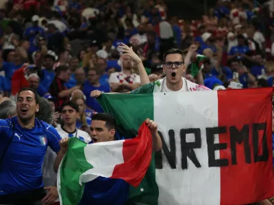 Italian fans cheer their teams during a Group B match between Croatia and Italy at the Euro 2024 soccer tournament in Leipzig, Germany, Monday, June 24, 2024. (AP Photo/Petr David Josek)