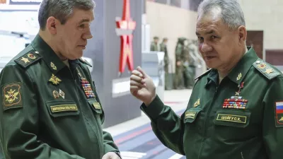 FILE - Russian Defense Minister Sergei Shoigu, right, gestures as he speaks to Russian Chief of General Staff Gen. Valery Gerasimov prior to a meeting Russian President Vladimir Putin with the top military brass in Moscow, Russia, Tuesday, Dec. 19, 2023. The International Criminal Court issued arrest warrants Tuesday for Russia's former defense minister and its military chief of staff for attacking civilian targets in Ukraine.(Sputnik, Kremlin Pool Photo via AP, File)