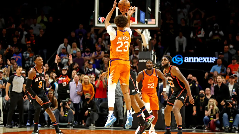 Mar 4, 2022; Phoenix, Arizona, USA; Phoenix Suns forward Cameron Johnson (23) shoots the game winning shot in the closing seconds of the game against the New York Knicks at Footprint Center. Mandatory Credit: Mark J. Rebilas-USA TODAY Sports