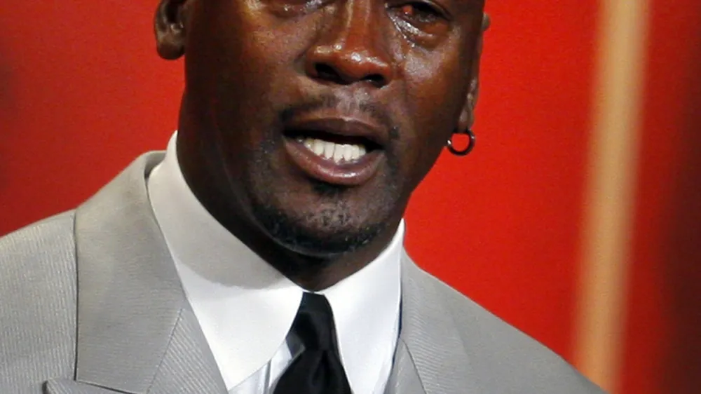 Former NBA player and 2009 inductee Michael Jordan becomes emotional as he takes the stage during the Naismith Memorial Basketball Hall of Fame Class of 2009 Enshrinement Ceremony in Springfield, Massachusetts September 11, 2009. REUTERS/Brian Snyder (UNITED STATES SPORT BASKETBALL)