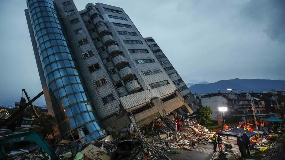 epaselect epa06502253 Rescue services search for people in a damaged building in Hualien, eastern Taiwan, 07 February 2018, after a magnitude 6.4 earthquake hit Hualien on the night of 06 February 2018. Media reports said several buildings were damaged and at least four people were killed and some 100 were injured during the quake. Rescue teams are trying to rescue people inside the buildings. Some bridges and roads are damaged and the main road to Hualien, the Suhua Highway (Suao to Hualien Highway) is closed. More than 100 earthquakes have hit off Taiwan's east coast in the past three days. The Seismological Observation Center said they are cuased by the friction between the Philipine Plate and Eurasian Plate. EPA-EFE/RITCHIE B. TONGO