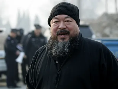 FILE - In this Nov. 17, 2010 file photo, artist Ai Weiwei arrives at the Wenyuhe court to support fellow artist Wu Yuren during his trial in Beijing. China blocked Ai Weiwei, one of its most famous contemporary artists from taking a flight to Hong Kong on Sunday, April 3, 2011 and police later raided his Beijing studio, the man's assistant said. (AP Photo/Andy Wong, File)