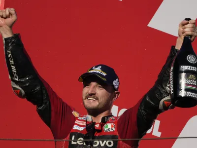 Australian rider Jack Miller of the Ducati Lenovo Team, celebrates on the podium after winning the Japanese Motorcycle Grand Prix at the Twin Ring Motegi circuit in Motegi, north of Tokyo Sunday, Sept. 25, 2022. (AP Photo/Shuji Kajiyama)