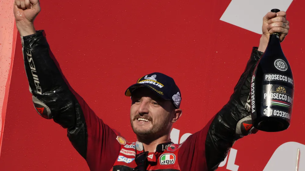 Australian rider Jack Miller of the Ducati Lenovo Team, celebrates on the podium after winning the Japanese Motorcycle Grand Prix at the Twin Ring Motegi circuit in Motegi, north of Tokyo Sunday, Sept. 25, 2022. (AP Photo/Shuji Kajiyama)