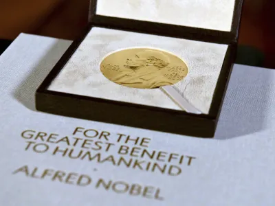 FILE - A Nobel diploma and medal are displayed, Tuesday, Dec. 8, 2020, during a ceremony in New York. (Angela Weiss/Pool Photo via AP, File)