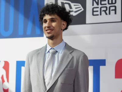 Zaccharie Risacher walks the red carpet before the NBA basketball draft, Wednesday, June 26, 2024, in New York. (AP Photo/Julia Nikhinson)