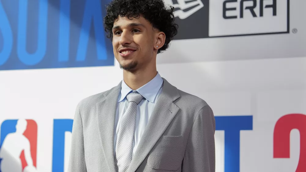 Zaccharie Risacher walks the red carpet before the NBA basketball draft, Wednesday, June 26, 2024, in New York. (AP Photo/Julia Nikhinson)