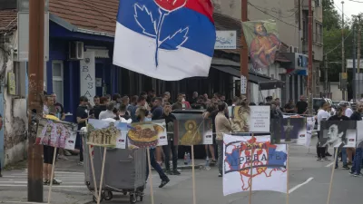 Right-wing extremists gather on a street in central Belgrade, Serbia, Thursday, June 27, 2024. Serbian police on Thursday banned a festival that promotes cultural exchange with Kosovo, in a sign of growing nationalism and government pressure on liberal voices in the Balkan country. The police ban came after several dozen right-wing extremists gathered outside the festival venue, seeking to prevent its holding while waving Serbian flags. (AP Photo/Marko Drobnjakovic)