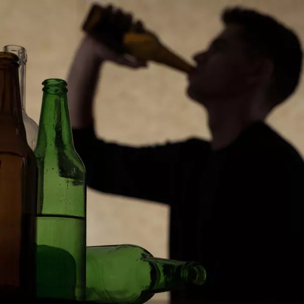 Alcoholism among young people - teenager drinking beer