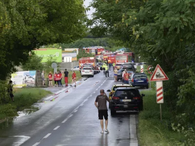 Firefighters vehicles and emergency vehicles on the site of the collision of a bus with a train near the town of Nove Zamky, Slovakia, Thursday, June 27, 2024. Officials in Slovakia says that a train traveling from the Czech capital of Prague to the Hungarian capital of Budapest collided with a bus in southern Slovakia, leaving at least five people dead and five injured. Police and railway officials say that more than 100 people were aboard the Eurocity train when the accident took place shortly after 5 p.m. (1500 GMT) in the town of Nove Zamky. (Henrich Misovic/TASR via AP)