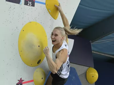 Slovenian climber Janja Garnbret cheers during the European Championship, combination, women, bouldering, final in Munich, Germany, Wednesday, Aug.17, 2022. (Angelika Warmuth/dpa via AP)