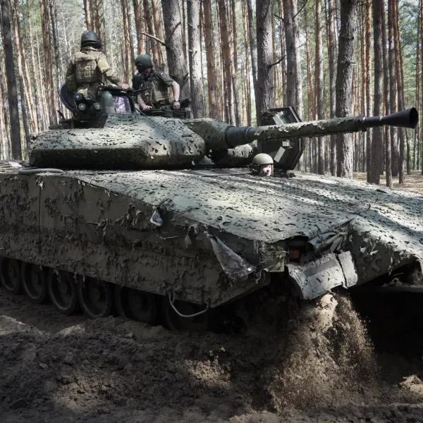 FILE - Ukrainian soldiers ride in a combat vehicle near the front line in the Kharkiv region of Ukraine, on Tuesday, June 18, 2024. Russia's offensive near the city of Kharkiv that began in May has apparently lost momentum after Ukraine bolstered its forces in the area by redeploying troops there from other sectors. (AP Photo/Andrii Marienko, File)