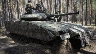 FILE - Ukrainian soldiers ride in a combat vehicle near the front line in the Kharkiv region of Ukraine, on Tuesday, June 18, 2024. Russia's offensive near the city of Kharkiv that began in May has apparently lost momentum after Ukraine bolstered its forces in the area by redeploying troops there from other sectors. (AP Photo/Andrii Marienko, File)