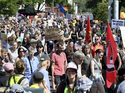 People gather to demonstrate against the AfD national party conference in Essen, Germany, Saturday June 29, 2024. The far-right Alternative for Germany party is holding a convention in the western city of Essen and large-scale protests against the party are taking place. (Henning Kaiser/dpa via AP)