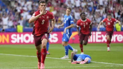 Switzerland's Remo Freuler (8) celebrates after scoring during a round of sixteen match between Switzerland and Italy at the Euro 2024 soccer tournament in Berlin, Germany, Saturday, June 29, 2024. (AP Photo/Matthias Schrader)