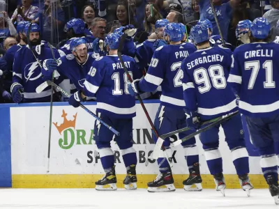 May 23, 2022; Tampa, Florida, USA; Tampa Bay Lightning left wing Ondrej Palat (18) is congratulated by teammates as he scores an empty net goal against the Florida Panthers during the third period at Amalie Arena. Mandatory Credit: Kim Klement-USA TODAY Sports