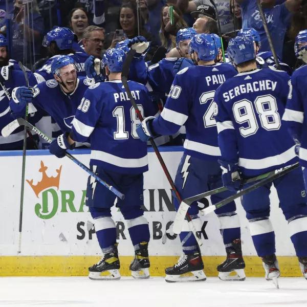 May 23, 2022; Tampa, Florida, USA; Tampa Bay Lightning left wing Ondrej Palat (18) is congratulated by teammates as he scores an empty net goal against the Florida Panthers during the third period at Amalie Arena. Mandatory Credit: Kim Klement-USA TODAY Sports