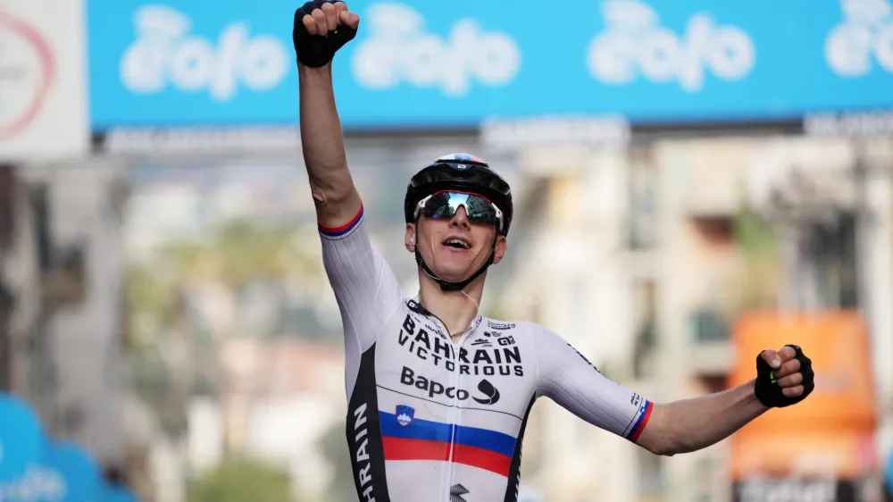 Slovenia's Matej Mohoric celebrates winning the Milano Sanremo (Milan to San Remo) cycling race, in Sanremo, Italy, Saturday, March 19, 2022. (Gian Mattia D'Alberto/LaPresse via AP)