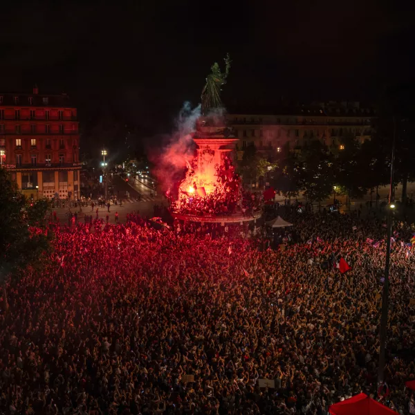 People gather at Republique plaza to protest the far-right National Rally, which came out strongly ahead in first-round legislative elections, Sunday, June 30, 2024, in Paris. France's high-stakes legislative elections propelled the far-right National Rally to a strong but not decisive lead in the first-round vote Sunday, polling agencies projected, dealing another slap to centrist President Emmanuel Macron. (AP Photo/Louise Delmotte)