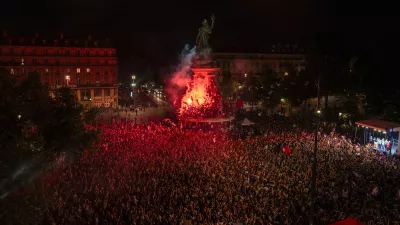 People gather at Republique plaza to protest the far-right National Rally, which came out strongly ahead in first-round legislative elections, Sunday, June 30, 2024, in Paris. France's high-stakes legislative elections propelled the far-right National Rally to a strong but not decisive lead in the first-round vote Sunday, polling agencies projected, dealing another slap to centrist President Emmanuel Macron. (AP Photo/Louise Delmotte)