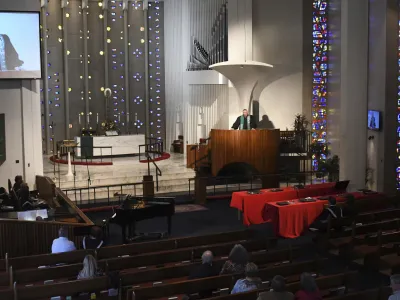 Rev. Chris Morgan leads his congregation at Christ United Methodist Church in Bethel Park Sunday, Oct. 9, 2022. The church has a diverse congregation with most leaning toward the center. In regional gatherings across the country this year, United Methodists approved requests of about 300 congregations to quit the denomination primarily over debates over sexuality and theology. (AP Photo/Philip G. Pavely)