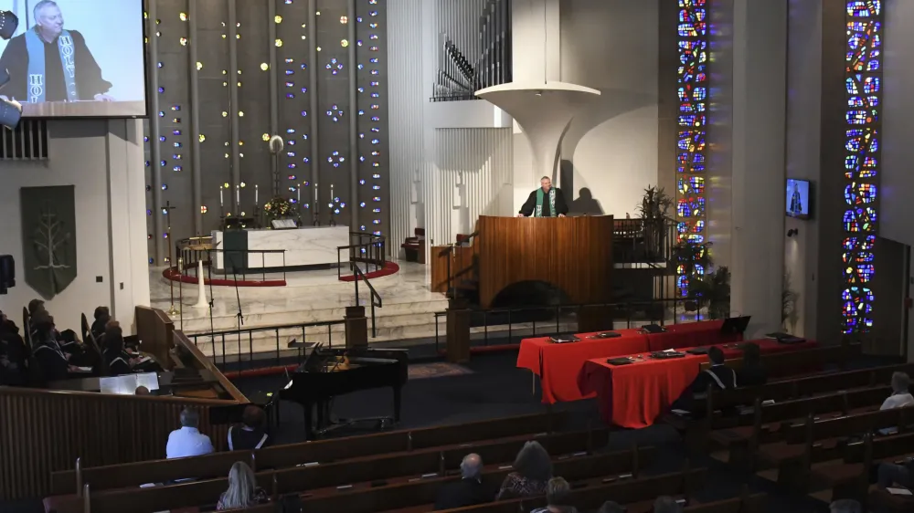 Rev. Chris Morgan leads his congregation at Christ United Methodist Church in Bethel Park Sunday, Oct. 9, 2022. The church has a diverse congregation with most leaning toward the center. In regional gatherings across the country this year, United Methodists approved requests of about 300 congregations to quit the denomination primarily over debates over sexuality and theology. (AP Photo/Philip G. Pavely)