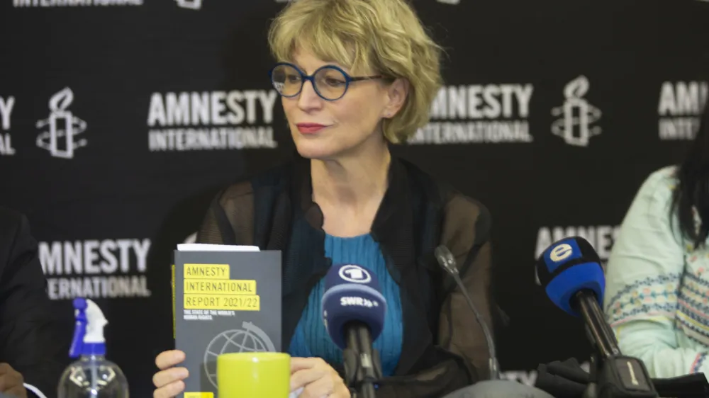 Amnesty International's secretary-general Agnes Callamard attends a news conference in Johannesburg, Monday, March 28, 2022. Amnesty International accuses Russia of committing war crimes in the Ukrainian city of Mariupol. Callamard said the rights organization will soon release an in-depth report on the devastation caused by Russia's assault on the city. (AP Photo/Denis Farrell).