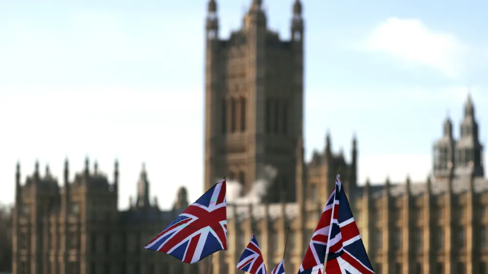 ﻿British Union flags fly in front of The Houses of Parliament in London, Tuesday, Jan. 22, 2019. British Prime Minister Theresa May launched a mission to resuscitate her rejected European Union Brexit divorce deal, setting out plans to get it approved by Parliament. (AP Photo/Frank Augstein)