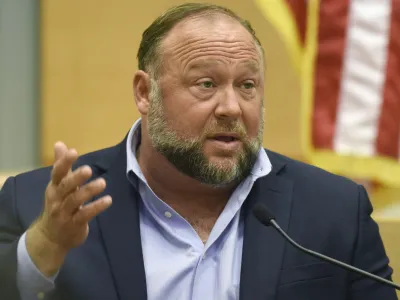 FILE - Infowars founder Alex Jones testifies at the Sandy Hook defamation damages trial at Connecticut Superior Court in Waterbury, Conn., on Thursday, Sept. 22, 2022. A six-person jury reached a verdict Wednesday, Oct. 12, 2022, saying that Jones should pay 5 million to 15 plaintiffs who suffered from his lies about the Sandy Hook school massacre. Jones and his company were found liable for damages last year. (Tyler Sizemore/Hearst Connecticut Media via AP, Pool, File)