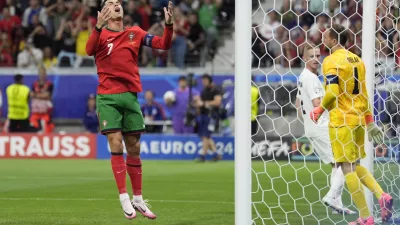 Portugal's Cristiano Ronaldo reacts after missing a scoring chance during a round of sixteen match between Portugal and Slovenia at the Euro 2024 soccer tournament in Frankfurt, Germany, Monday, July 1, 2024. (AP Photo/Ariel Schalit)