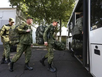 FILE - Russian recruits take a bus near a military recruitment center in Krasnodar, Russia, Sunday, Sept. 25, 2022. Russian President Vladimir Putin on Wednesday ordered a partial mobilization of reservists to beef up his forces in Ukraine. (AP Photo, File)