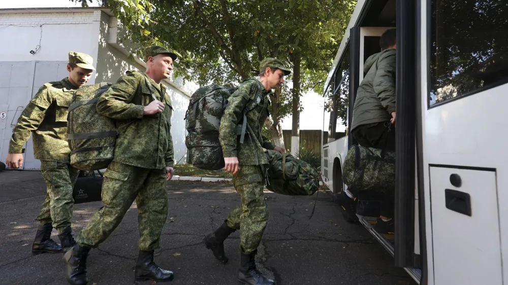 FILE - Russian recruits take a bus near a military recruitment center in Krasnodar, Russia, Sunday, Sept. 25, 2022. Russian President Vladimir Putin on Wednesday ordered a partial mobilization of reservists to beef up his forces in Ukraine. (AP Photo, File)