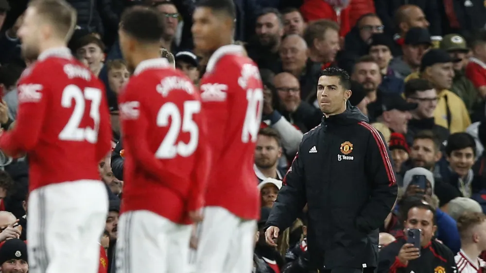 Soccer Football - Premier League - Manchester United v Tottenham Hotspur - Old Trafford, Manchester, Britain - October 19, 2022 Manchester United's Cristiano Ronaldo walks to the substitutes bench ahead of the match REUTERS/Craig Brough EDITORIAL USE ONLY. No use with unauthorized audio, video, data, fixture lists, club/league logos or 'live' services. Online in-match use limited to 75 images, no video emulation. No use in betting, games or single club /league/player publications. Please contact your account representative for further details.