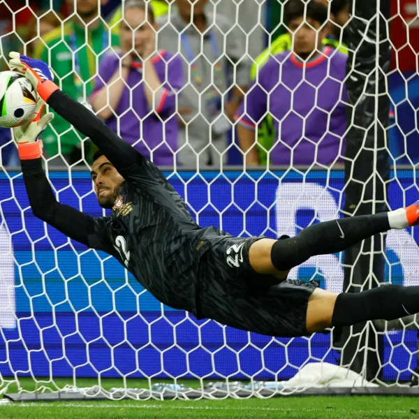 FILE PHOTO: Soccer Football - Euro 2024 - Round of 16 - Portugal v Slovenia - Frankfurt Arena, Frankfurt, Germany - July 1, 2024 Portugal's Diogo Costa saves a penalty during the shootout missed by Slovenia's Jure Balkovec REUTERS/Wolfgang Rattay/File Photo