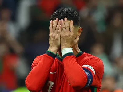 Soccer Football - Euro 2024 - Round of 16 - Portugal v Slovenia - Frankfurt Arena, Frankfurt, Germany - July 1, 2024 Portugal's Cristiano Ronaldo looks dejected after missing a penalty kick REUTERS/Kai Pfaffenbach