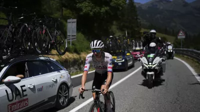 Slovenia's Tadej Pogacar rides during the fourth stage of the Tour de France cycling race over 139.6 kilometers (86.7 miles) with start in Pinerolo, Italy and finish in Valloire, France, Tuesday, July 2, 2024. (AP Photo/Daniel Cole)