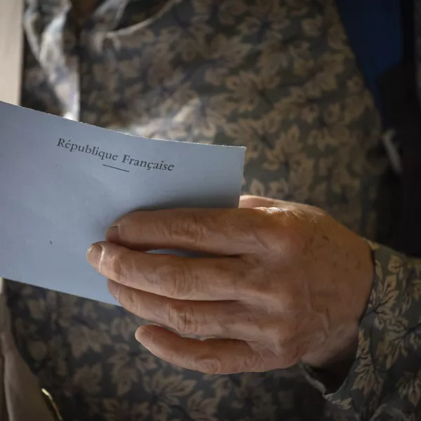 A voter casts a ballot at a polling station for the first round of the parliamentary elections in Paris, Sunday, June 30, 2024. (AP Photo/Aurelien Morissard)