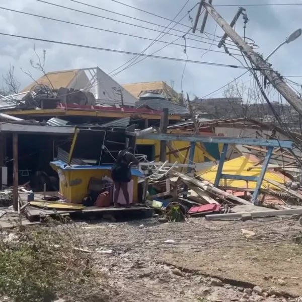 A person stands amidst damaged property following the passing of Hurricane Beryl, in Union Island, Saint Vincent and the Grenadines, in this screen grab taken from a handout video released on July 2, 2024. The Agency For Public Information St. Vincent and the Grenadines/Handout via REUTERS  THIS IMAGE HAS BEEN SUPPLIED BY A THIRD PARTY. NO RESALES. NO ARCHIVES. MANDATORY CREDIT