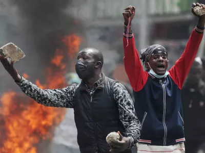 Protesters hold stones during a demonstration over police killings of people protesting against the imposition of tax hikes by the government, in Nairobi, Kenya, July 2, 2024. REUTERS/John Muchucha