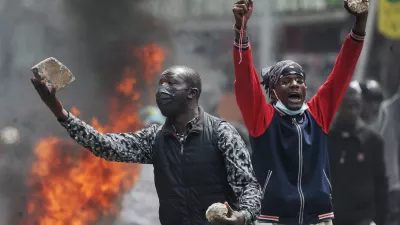 Protesters hold stones during a demonstration over police killings of people protesting against the imposition of tax hikes by the government, in Nairobi, Kenya, July 2, 2024. REUTERS/John Muchucha