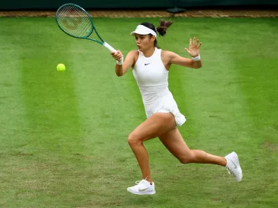 Tennis - Wimbledon - All England Lawn Tennis and Croquet Club, London, Britain - July 3, 2024 Britain's Emma Raducanu in action during her second round match against Belgium's Elise Mertens REUTERS/Hannah Mckay