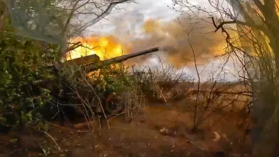 In this photo taken from video released by Russian Defense Ministry Press Service on Wednesday, July 3, 2024, Russian soldiers fire from their 152-mm «Giatsint-B» howitzer from their position at Ukrainian troops at an undisclosed location in Ukraine. (Russian Defense Ministry Press Service via AP)